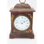 An early 20th century chinoiserie lacquered mantel clock, the enamel dial showing Roman numerals,