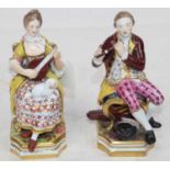 A pair of Derby style soft-paste porcelain figures of musicians, each in seated pose, he in red