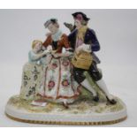 An early 20th century porcelain figure group, modelled as a couple with child and bird, on a