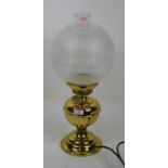 A late Victorian brass oil lamp (converted) 44cm high including shade