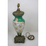 A 20th century green and gilt decorated milk glass table lamp, mounted upon a Rococo style brass