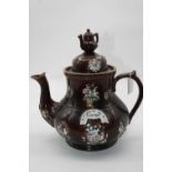 A Victorian bargeware teapot, inscribed "A present for a friend" to the shoulder, 29cm highSpout and