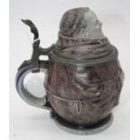 A 19th century continental stoneware novelty tankard in the form of a Friar, having pewter mount and