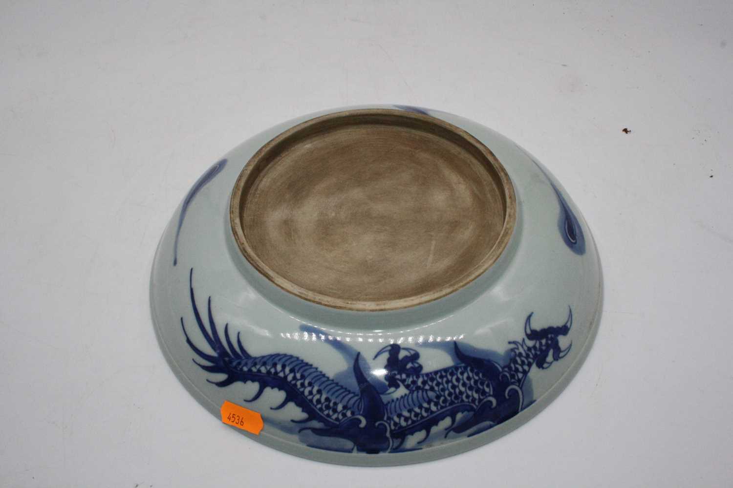 A Chinese export blue & white dish underglaze blue decorated with a four claw dragon chasing a - Image 2 of 3