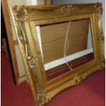 A Victorian style gilt composition picture frame, rebate dimensions 61 x 46cm; together with two