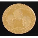 Germany, 1969 Apollo 11 gold commemorative coin, obv; busts of three pilots, rev; spacecraft on