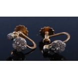 A pair of 9ct yellow and white gold diamond flower cluster earrings, each with eight old European