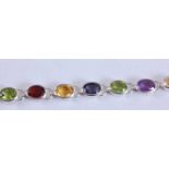 A sterling silver multi-stone bracelet, featuring four oval peridot, four oval garnet, four oval