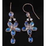 A pair of yellow metal moonstone flower cluster earrings, each featuring six oval and two round