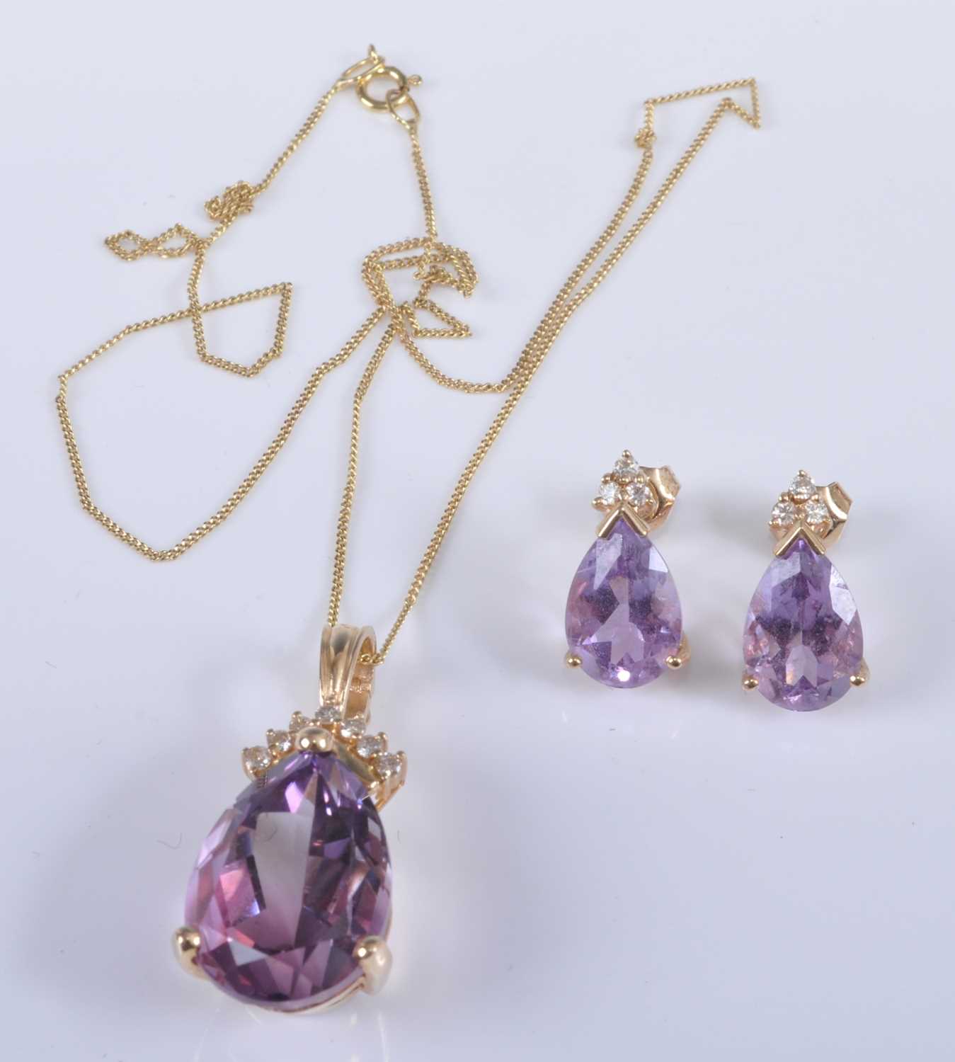 A 14ct yellow gold, amethyst and diamond pendant and earring set, the pendant featuring a pear cut - Image 2 of 2