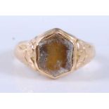 A Victorian 15ct yellow gold shield shaped signet ring with engraved shoulders, stone deficient,