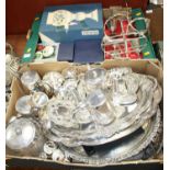 Two boxes containing a collection of silver plated wares, to include teapots, candlesticks, dressing