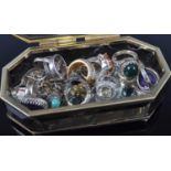 Assorted costume jewellery, largely being rings, in a glass ring box