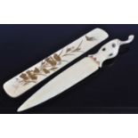 A Japanese Meiji (1868-1912) shibayama ivory paper knife, the handle carved as a berry with stalk,