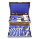 An oak cased canteen of silver plated flatware