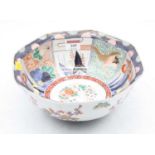 A reproduction export bowl, of octagonal form, enamel decorated in the imari palette, dia.24cm