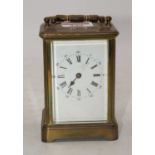 An early 20th century lacquered brass carriage clock, the enamel dial showing Roman numerals (a/f)