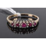 A 9ct gold, ruby and diamond point set half hoop ring, 2.2g, size U