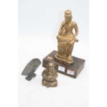 A bronze model of Buddha, h.10cm; together with a miniature pewter table screen; and a giltwood