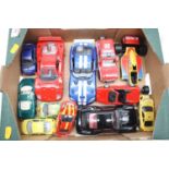 A box containing a collection of diecast model vehicles to include Bburago