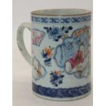 An 18th century Chinese export porcelain tankard, decorated with figures within an interior, h.