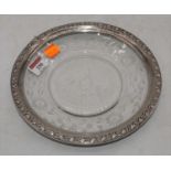 A 20th century floral engraved glass dish, having repoussee decorated white metal rim, dia. 23cm
