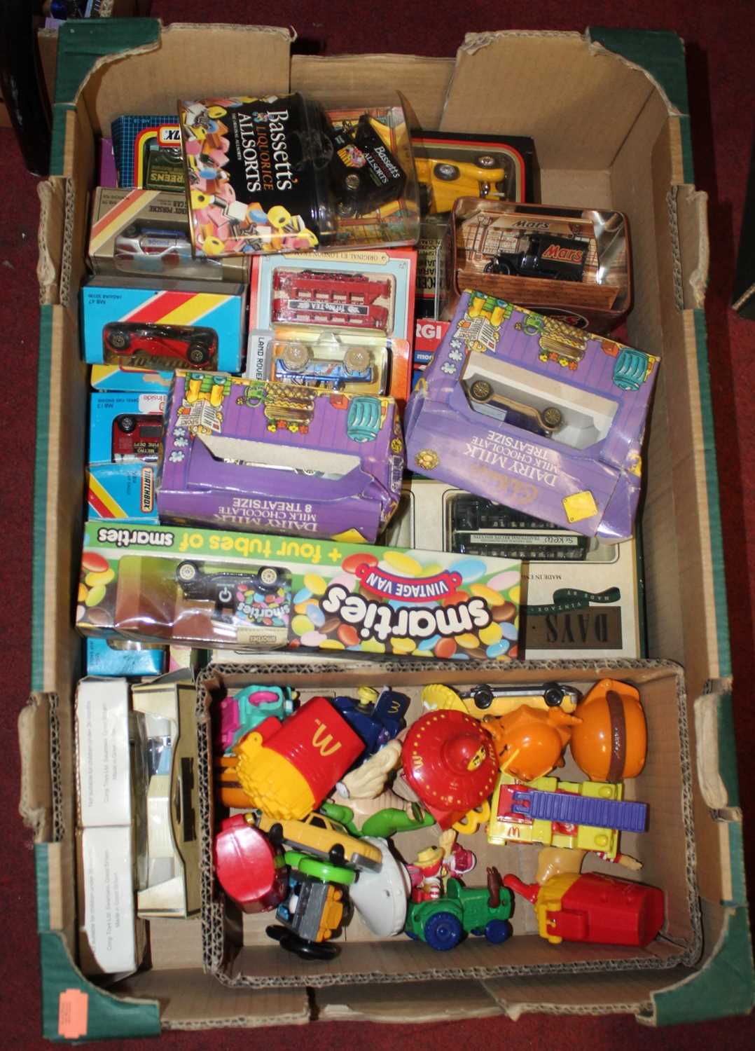 A collection of various vintage toys to include diecast model vehicles and McDonalds Happy Meal
