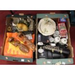 Two boxes of miscellaneous items to include a pair of carved African figures, various cat ornaments,