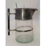 In the manner of Dr Christopher Dresser, a silver plated and glass water jug, height 23cmNo markings