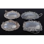 A pair of Victorian style silver and embossed decanter collars, annotated for Brandy and Gin;