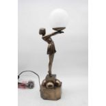A reproduction Art Deco style table lamp in the form of a female dancer with outstretched arms