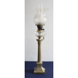 A Victorian pedestal oil lamp, having an etched frilled glass shade above a clear glass font, on a