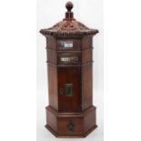 A Victorian style country house type pillarbox letterbox of hexagonal form having a turned finial