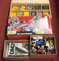 A plywood box containing various loose Meccano components; together with a boxed Micro Machines