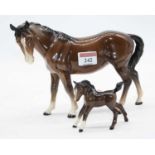 A Beswick model of a mare, model No. 976, brown gloss, height 17cm; together with a similar foal