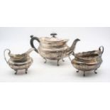 A matched Victorian silver three-piece tea service, the teapot of boat form having ebony handle,