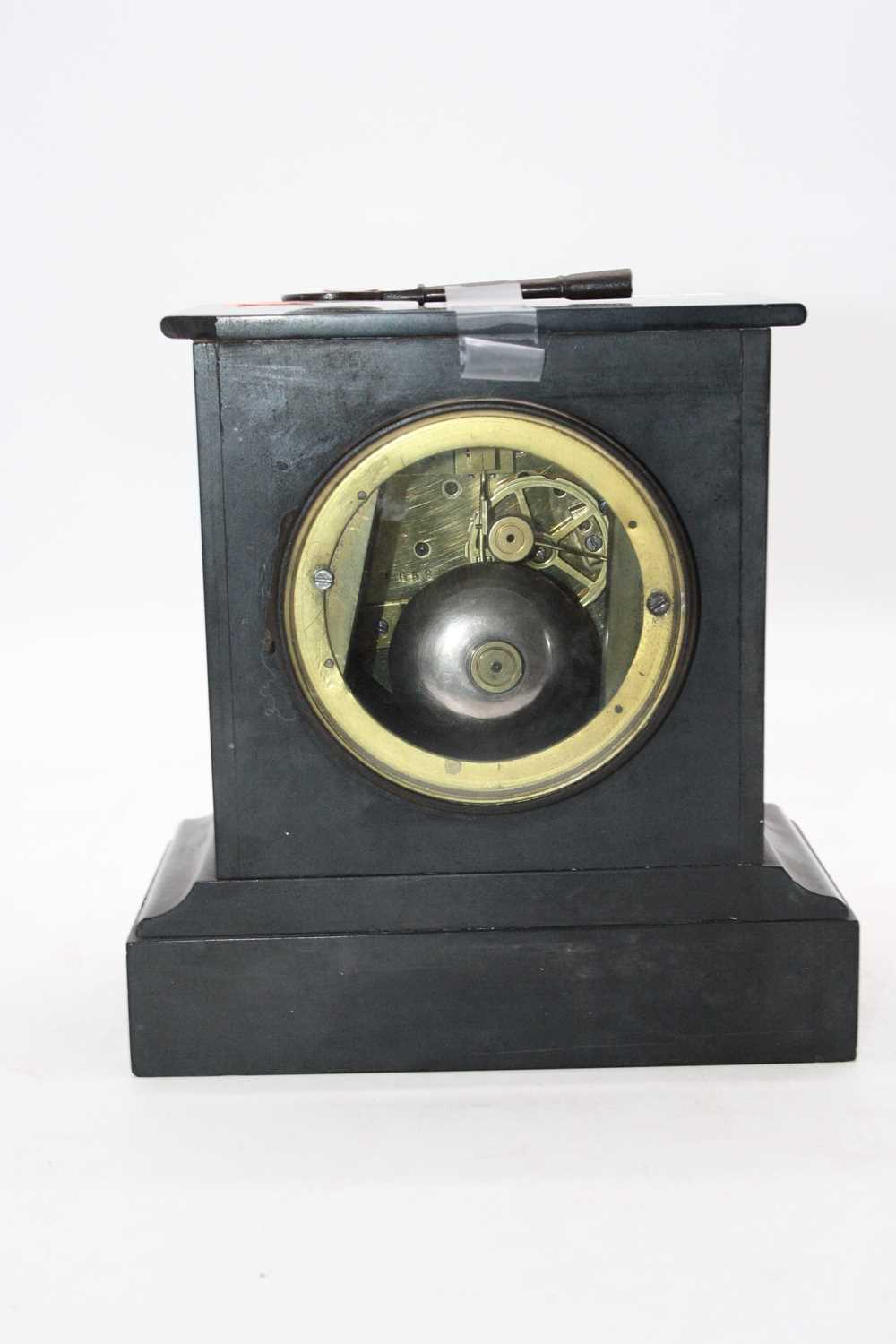 An Edwardian black slate cased mantel clock having a circular enamelled dial with Roman numerals and - Image 3 of 3