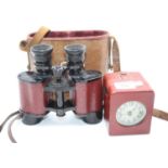 A pair of Teleska Colmont binoculars, cased; together with a red leather cased travel clock (2)