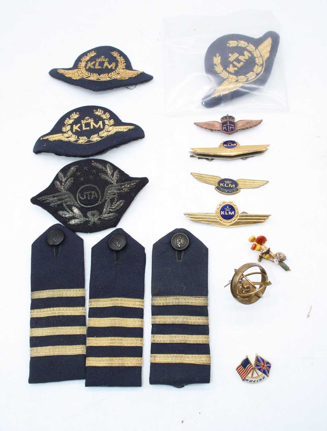 A small collection of miscellaneous items to include KLM bullion badges, shoulder titles etc