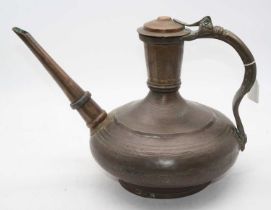 An early 20th century Arabic copper kettle of squat circular form with incised banded decoration and