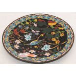 A 20th century cloisonne enamel decorated dish, dia.31cmQuite worn overall.The footrim is badly