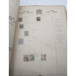 A vintage stamp album and contents