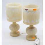 A pair of turned alabaster table lamps, each carved with flowers, h.28cm