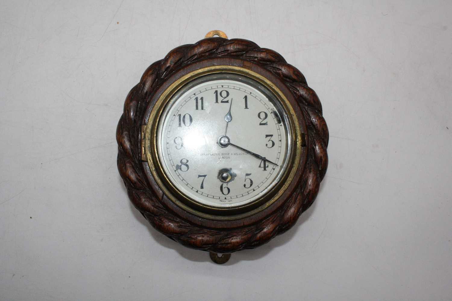 An early 20th century oak cased aneroid barometer the circular silvered dial with Arabic numerals, - Image 2 of 5