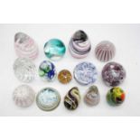 A collection of glass paperweights (14)