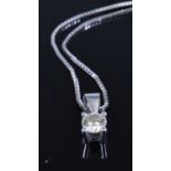 An 18ct white gold diamond pendant, the four claw set round brilliant weighing approx 0.4 carats, to