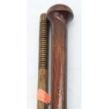 A 20th century simulated rosewood walking cane, having ring turned handle, length 92cm; together