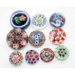 A collection of 10 glass paperweights to include millefiore examplesTop left paperweight in the main