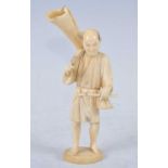 A Japanese Meiji period (1868-1912) ivory okimono, carved as a male bamboo cutter in standing pose