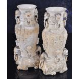 A pair of 19th century Chinese Canton carved ivory Hu vases, each neck having four zoomorphic